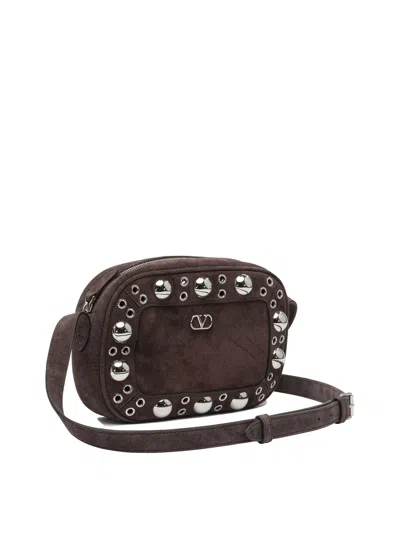 Valentino Garavani Dome-shaped Crossbody Bag With Metallic Eyelets And Adjustable Strap In Brown