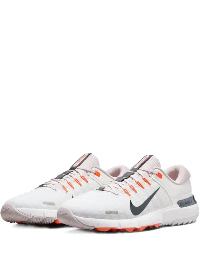 Nike Free Gold Sneakers