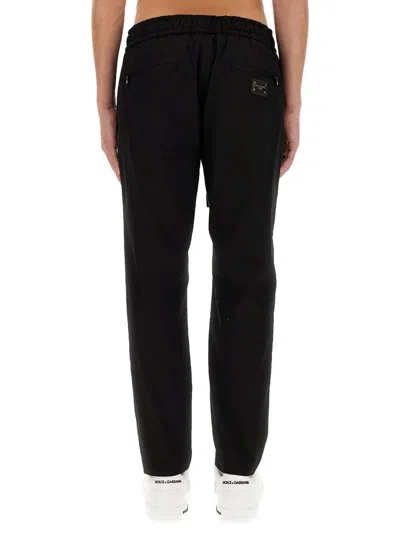Dolce & Gabbana Jogging Pants With Plaque Detail In Black