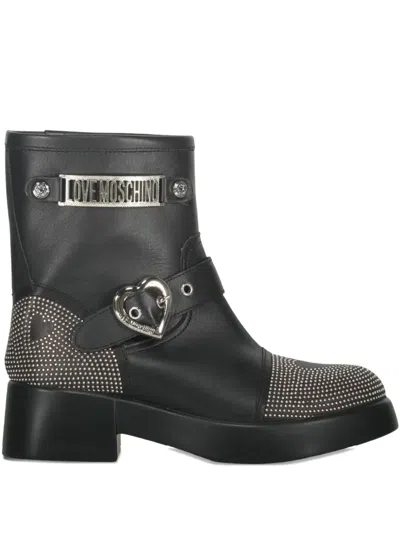 Moschino Buckle-detailed Studded Ankle Boots In Black