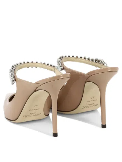 Jimmy Choo Bing 100 Patent Leather Pumps In Gold