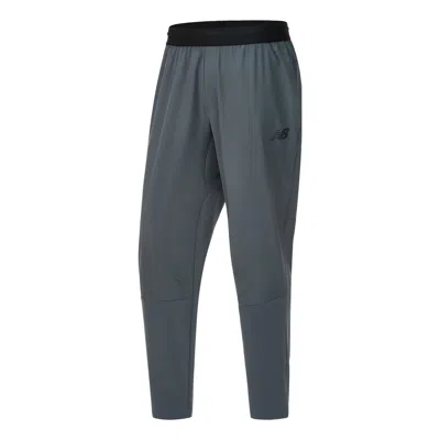 New Balance Rwtech Stretch Woven Pants 'lead' In Blue