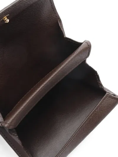 Pre-owned Louis Vuitton 2007 Damier Ebène Coin Purse In Brown