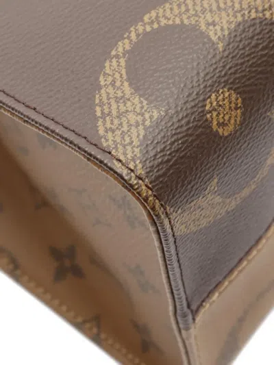 Pre-owned Louis Vuitton 2021 Monogram Giant Reverse On-the-go Mm Tote Bag In Brown