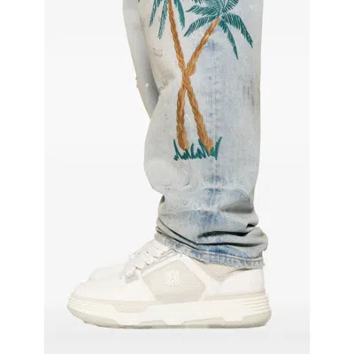 Amiri Distressed Embroidered Denim Trousers In Blue