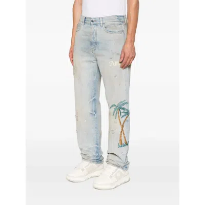 Amiri Distressed Embroidered Denim Trousers In Blue