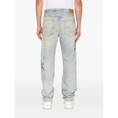 Amiri Distressed Embroidered Denim Trousers In Blue