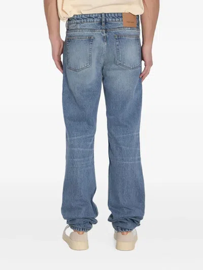 Ami Alexandre Mattiussi Ami Straight-leg Denim Jeans With Faded Blue Wash And Leather Accent