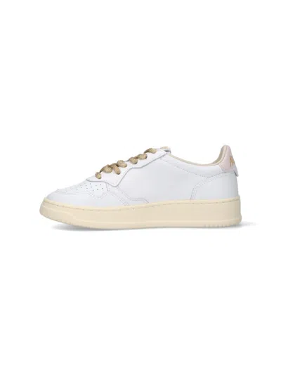 Autry Low-top Sneakers With Suede Accents And Golden Details In White