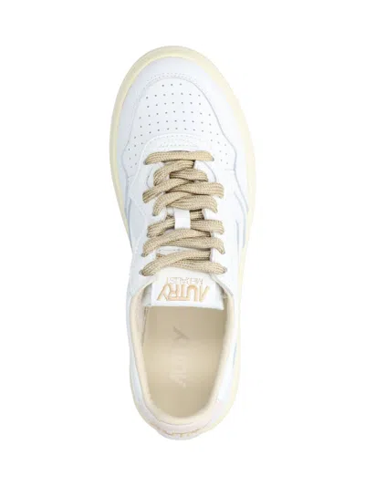 Autry Low-top Sneakers With Suede Accents And Golden Details In White