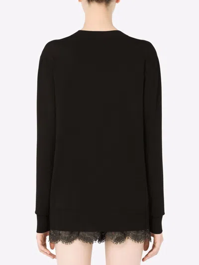 Dolce & Gabbana Viscose Sweater With Crystal Dg Embellishment In Black