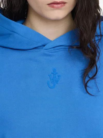 Jw Anderson Anchor Logo Embroidered Crop Hoodie In Blue