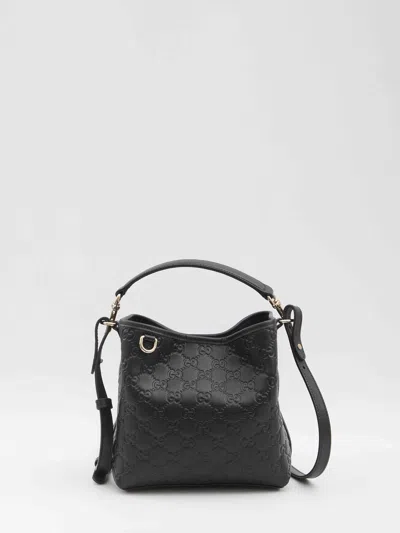 Gucci Gg Emblem Small Leather Bucket Bag In Black