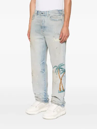 Amiri Distressed Embroidered Denim Trousers In Blue