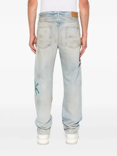 Amiri Distressed Embroidered Denim Trousers In Blue