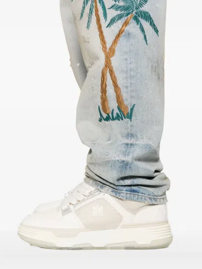 Amiri Distressed Embroidered Denim Trousers In Blue