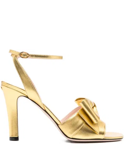 Valentino 100mm Bow-embellished Ankle-strap Sandals In Gold