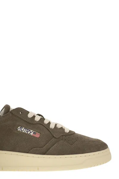 Autry Low-top Suede Sneakers With Rubber Sole And Lace-up Closure In Brown