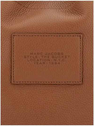 Marc Jacobs 'the Bucket' Brown Crossbody Bag With Embossed Logo On The Front In Hammered Leather Woman