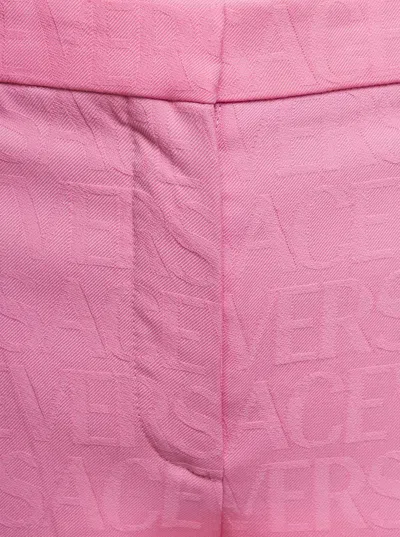Versace Pink Flare Pants With Tonal Logo Lettering In Wool Woman