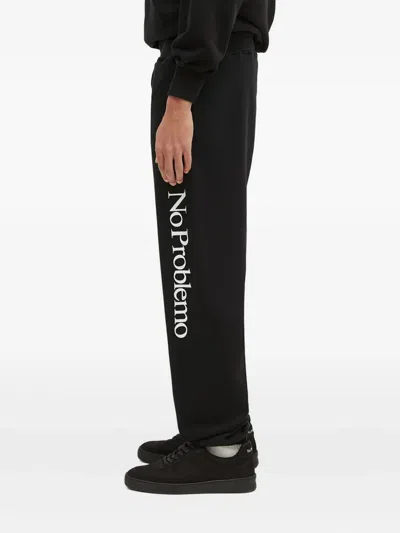 Aries Slogan-print Sweatpants In Black