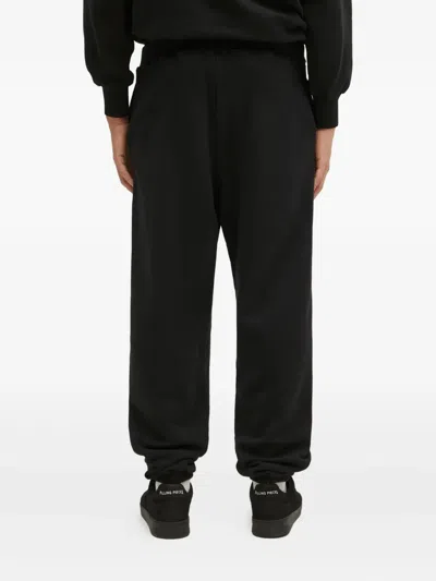 Aries Slogan-print Sweatpants In Black