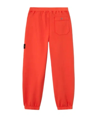 Stone Island Loose-fit Joggers With Pockets And Elasticated Cuffs In Red