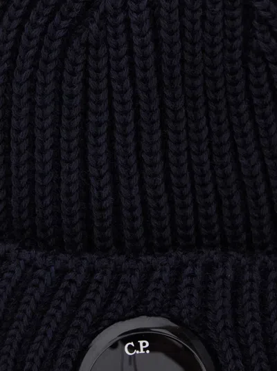 C.p. Company Men Blue Knit Beanie With Logo Plaque On The Front In Wool Man In Black