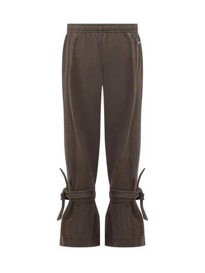Jw Anderson Tie-fastening Cuffed Trousers In Brown