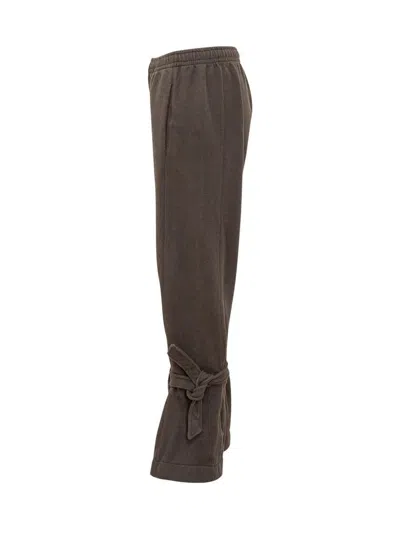 Jw Anderson Tie-fastening Cuffed Trousers In Brown