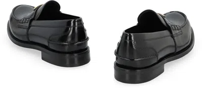 Prada Triangular Plaque Loafers In Black