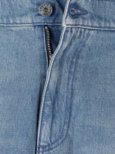 Jw Anderson Light Blue Bermuda Shorts With Cargo Pockets And Logo Patch On The Back