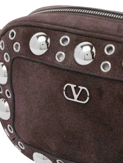 Valentino Garavani Dome-shaped Crossbody Bag With Metallic Eyelets And Adjustable Strap In Brown