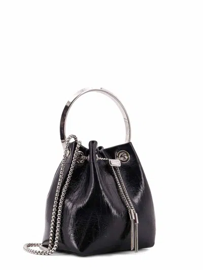 Jimmy Choo Eyelet Chain Bucket Bag With Metallic Handle In Black