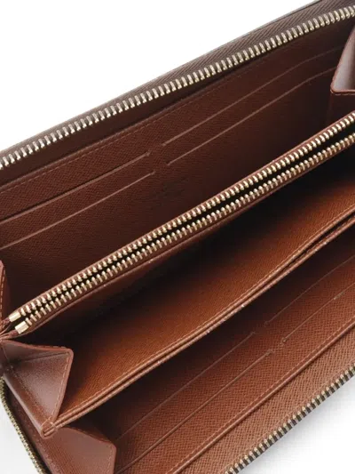 Pre-owned Louis Vuitton 2010 Zippy Wallet In Brown