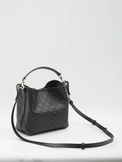 Gucci Gg Emblem Small Leather Bucket Bag In Black