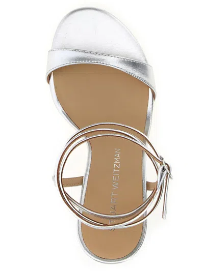 Stuart Weitzman Metallic Buckle Wrap Sandals In Silver