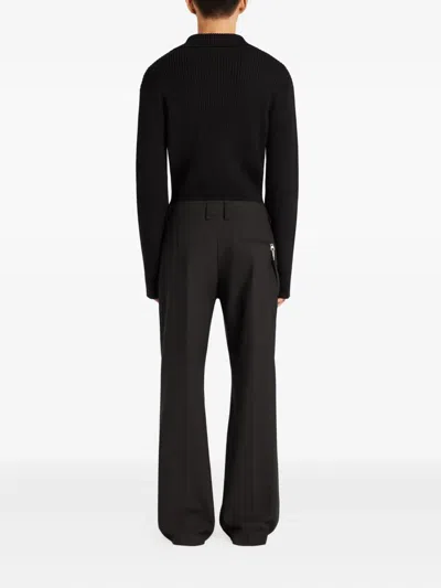 Courrèges Ribbed-knit Polo Sweater In Black