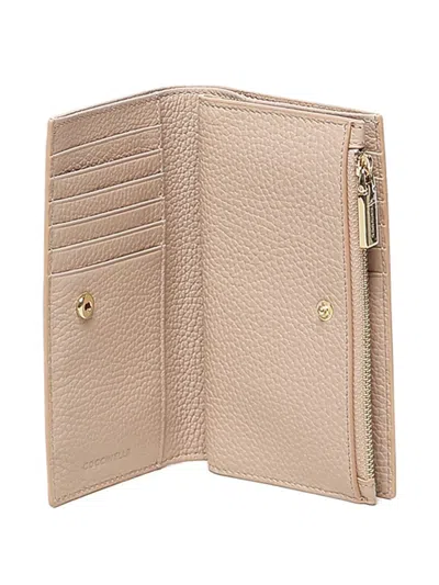Coccinelle Zip Three-compartment Wallet In Pink