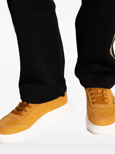 Alexander Mcqueen Logo Printed Low-top Sneakers In Orange