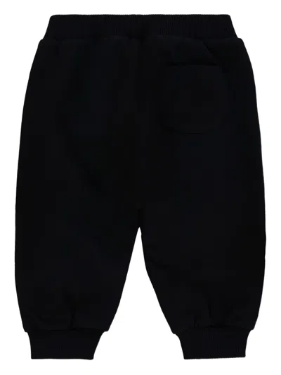 Moschino Teddy-print Cotton Trousers In Black
