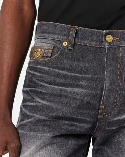 Versace Denim Jeans With Faded Effect And Contrast Stitching In Black