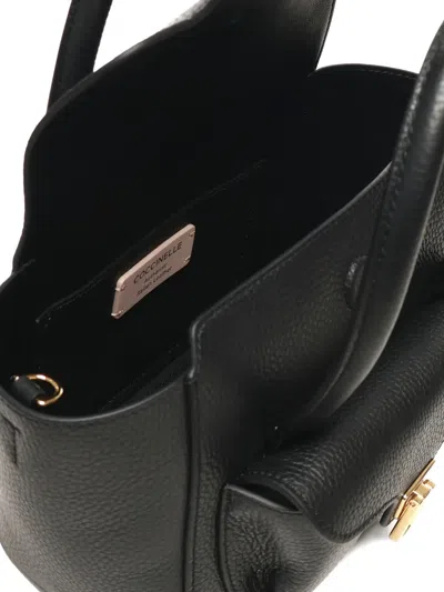 Coccinelle Double Beat Shoulder Bag In Black