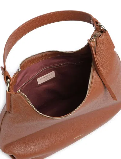 Coccinelle Rebekka Zip-up Shoulder Bag In Brown