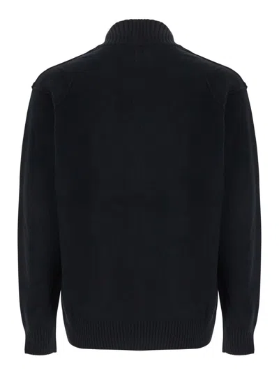 C.p. Company Black Jacket With High Neck And Logo Plaque On The Sleeve In Wool Blend Man In Black