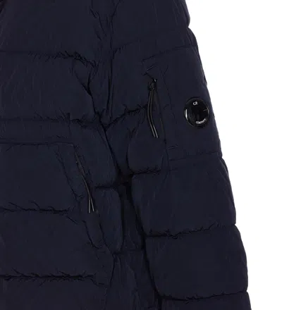 C.p. Company Blue Down Jacket With Fixed Hood And Logo Plaque On The Sleeve In Tech Fabric Man In Blue