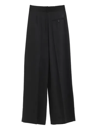 Loewe Pleated-front Trousers In Black