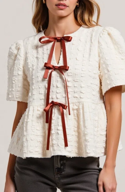 Modenaire Textured Puff-sleeve Peplum Blouse With Bow-tie Front