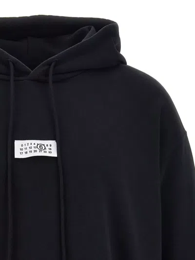 Mm6 Maison Margiela Mm6 By Maison Margiela Emblazoned Black Hoodie With Drawstring And Ribbed Finishes In Black