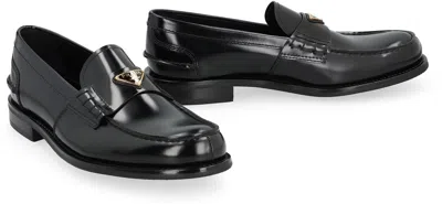 Prada Triangular Plaque Loafers In Black